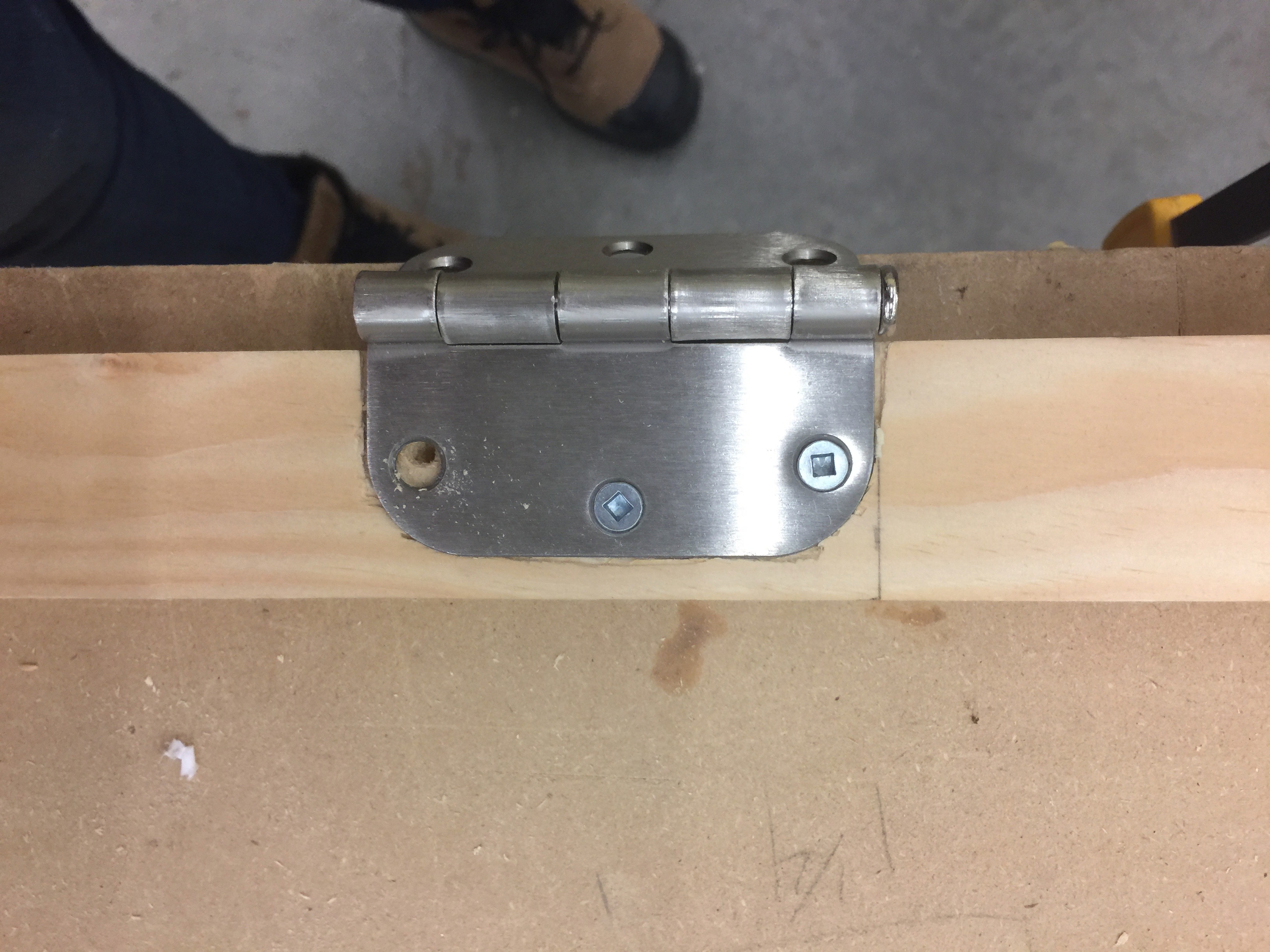 Attaching hinges to a piece of wood
